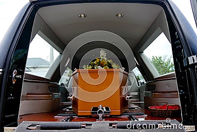 Shot of a colorful casket in a hearse or chapel before funeral or burial at cemetery Stock Photo