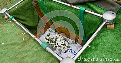 Closeup shot of a colorful casket in a hearse or chapel before funeral or burial at cemetery Stock Photo