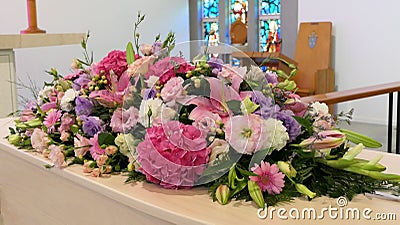 A colorful casket in a hearse or chapel before funeral or burial at cemetery Stock Photo