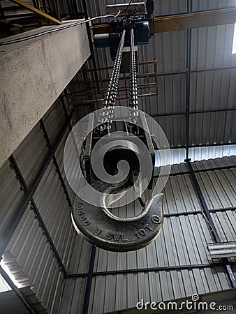 Closeup shot of crane hook hanging in the industry Editorial Stock Photo