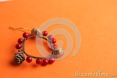 Closeup shot of a decorative wooden trinket isolated on an orange background Stock Photo