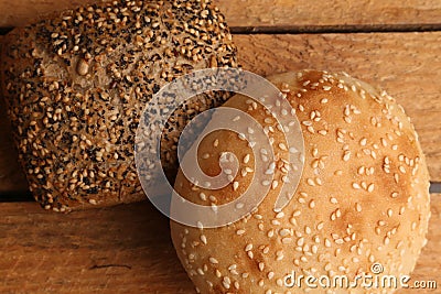 Closeup shot of delicious freshly-made artisanal brown bread with nuts on a wooden surface Stock Photo