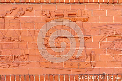 Closeup shot of a detail from the frieze showing the industrial heritage of Rugby Editorial Stock Photo