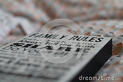 Closeup shot of a family rules wood poster for interior design Stock Photo