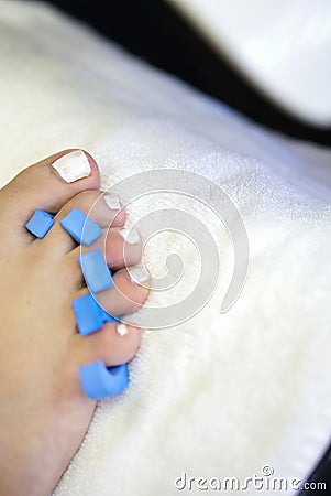 Closeup shot of female foot fingers during a manicure Stock Photo