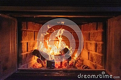 Closeup shot of a fire in a brick fireplace Stock Photo