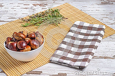Closeup shot of fresh chestnuts in a bowl in the kitchen Stock Photo