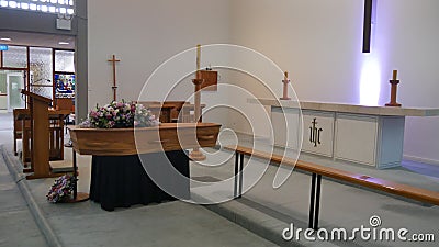 Closeup shot of a funeral casket in a hearse or chapel or burial at cemetery Editorial Stock Photo