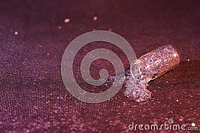 Closeup shot of glitter in a transparent small bottle Stock Photo