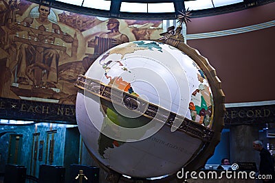 Closeup shot of the Globe in Los Angeles Time building with a mural in the background Editorial Stock Photo