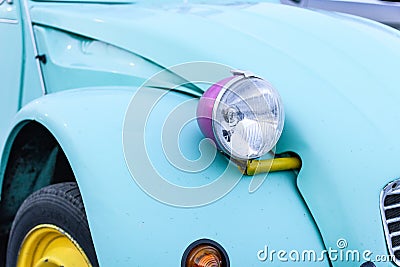 Closeup shot of headlight of blue vintage car Stock Photo