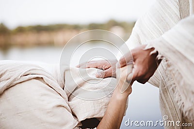 Closeup shot of Jesus Christ healing the female with a blurred background Stock Photo