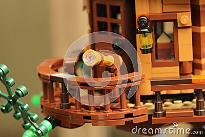 Closeup shot of a Lego treehouse room with a telescope Editorial Stock Photo