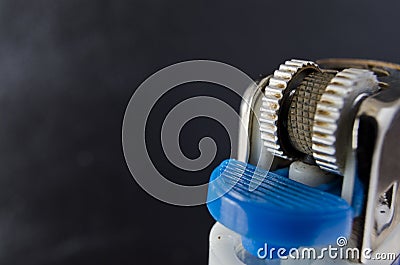 Closeup shot of lighter against a dark background Stock Photo