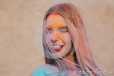 Closeup shot of merry blonde model posing with exploding dry blu Stock Photo
