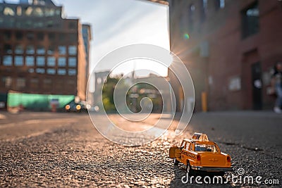 Closeup shot of a model taxi car in a street in New York, USA Stock Photo