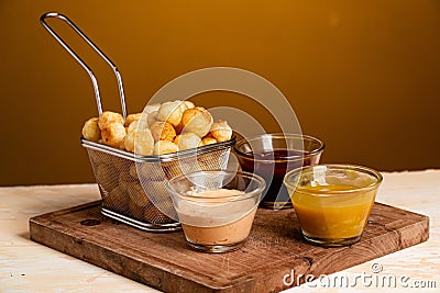 Closeup shot of Noisette potatoes with various sauces shot of Stock Photo