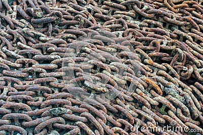 Closeup shot of old rusted chains on the ground Stock Photo