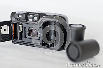 Closeup shot of the open back portion of a classic camera with films Stock Photo