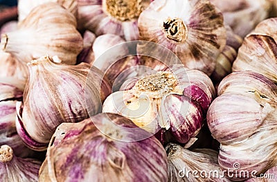 Closeup shot of organic unpeeled garlic bulbs Stock Photo