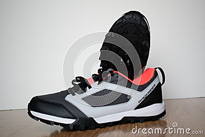 Closeup shot of a pair of sport shoes on a wooden surface Stock Photo