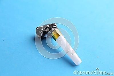 Closeup shot of a party noisemaker isolated on a blue background Stock Photo