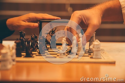 Closeup shot of people playing timed chess Stock Photo