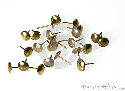 Closeup shot of a pile of antique bronze pin nails isolated on a white background Stock Photo