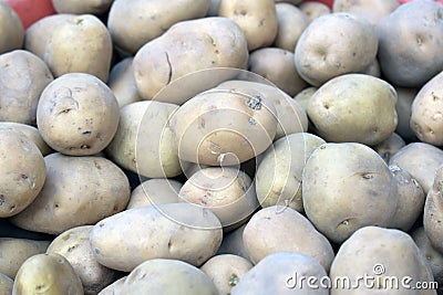 Closeup shot of a pile of potatoes in a market place Stock Photo