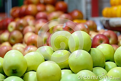 Closeup shot of a pile of shiny green apples Stock Photo