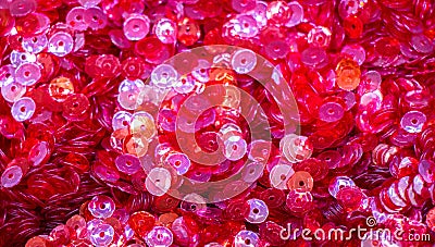 Closeup shot of a pile of shiny pink sequins in a container Stock Photo
