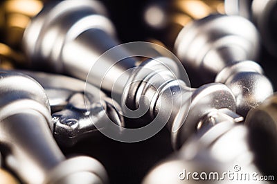 Closeup shot of a pile of silver and gold chess pieces Stock Photo