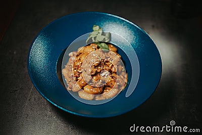 Closeup shot of a plate of macaroni in a beef sauce Stock Photo