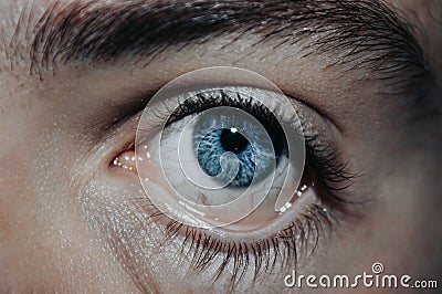 Closeup shot of a pulled down blue human eye with veins, Ophtalmology concept Stock Photo