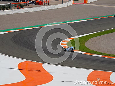 Closeup shot of a racing track with a motorcyclist Editorial Stock Photo