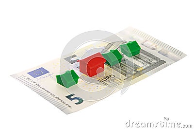 Closeup shot of real estate replica houses on euro banknotes isolated on white background Editorial Stock Photo