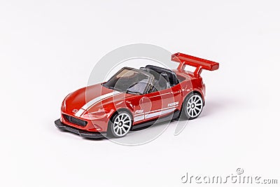 Closeup shot of a red Hot Wheels Mazda MX-5 Miata isolated on a white background Editorial Stock Photo