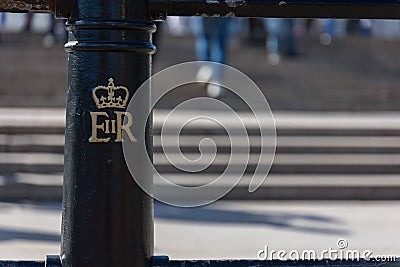 Closeup shot of the Royal Cypher of the Queen in the streets of London, United Kingdom Editorial Stock Photo