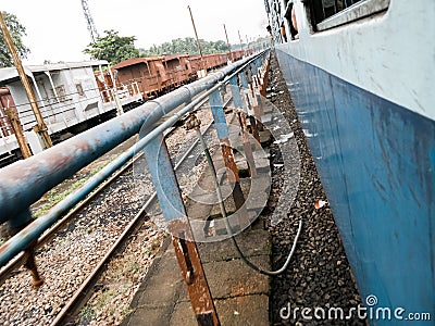 Closeup shot of rustic metal railings in a train station Stock Photo