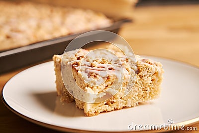 Closeup shot of a slice of a delicious apple pie on a plate on a wooden table Stock Photo