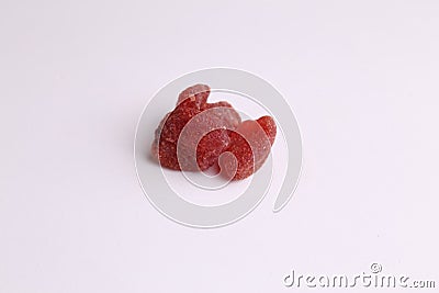 Closeup shot of small pieces of dried fruit on a monochrome background Stock Photo