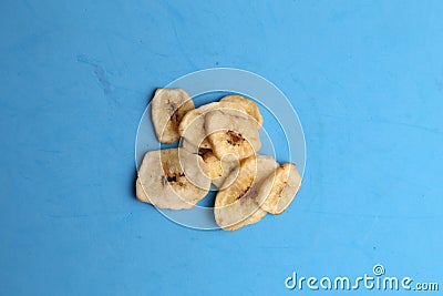 Closeup shot of small pieces of dried fruit on a monochrome background Stock Photo