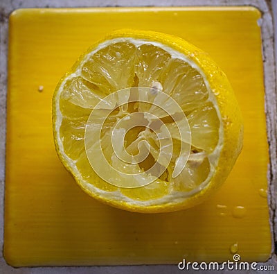 Closeup shot of a squeezed half lemon Stock Photo