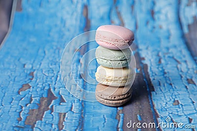 Closeup shot of a stack of delicious macarons on a wooden surface Stock Photo
