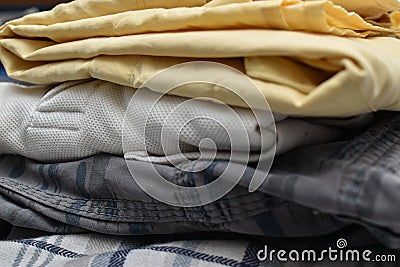 Closeup shot of Stack of folded cotton clothes Stock Photo