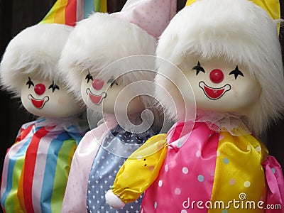 Closeup shot of three vintage clown dolls Stock Photo