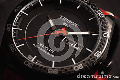 Closeup shot of a Tissot watch under dynamic lighting - Editorial Stock Photo