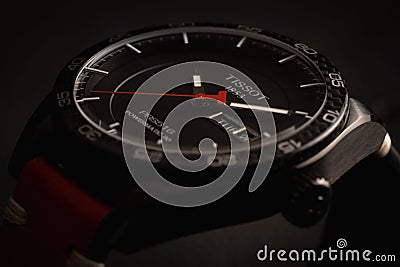 Closeup shot of a Tissot watch under dynamic lighting - concept of fashion Editorial Stock Photo