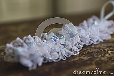 Closeup shot of a wedding garter on a blurred background Stock Photo