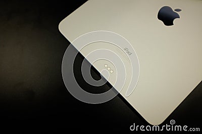 Closeup shot of a white iPad on a black background Editorial Stock Photo